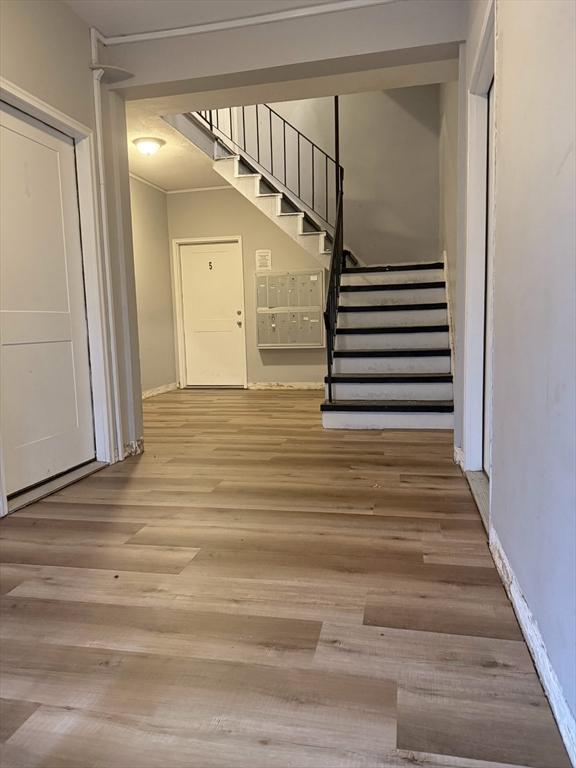 7 Esmond St, Boston, MA 02121 - stairs featuring baseboards and wood finished floors