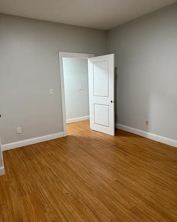 7 Esmond St, Boston, MA 02121 - unfurnished room with baseboards and wood finished floors