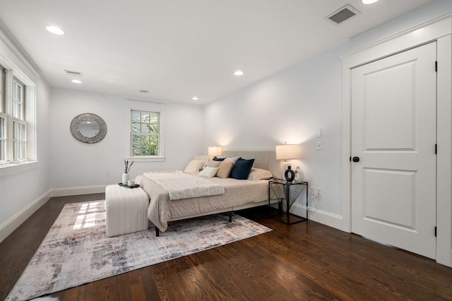 bedroom featuring visible vents, recessed lighting, baseboards, and wood finished floors