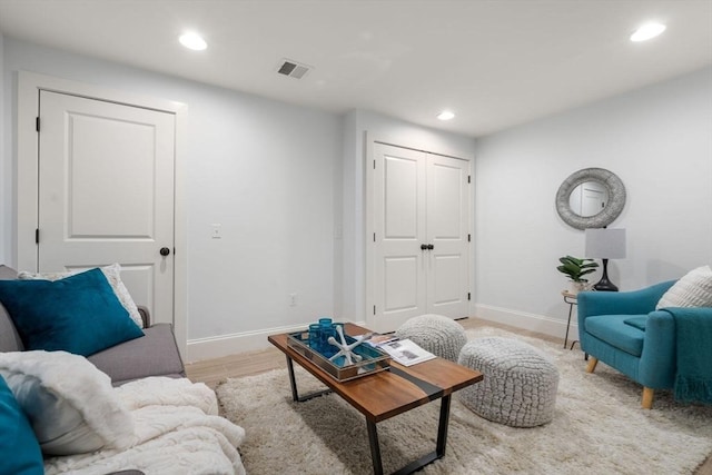 living room with recessed lighting, baseboards, and visible vents