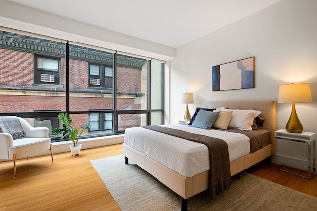 bedroom with hardwood / wood-style flooring