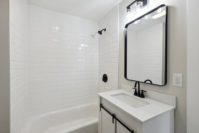 full bath featuring vanity and  shower combination