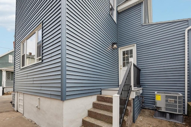 property entrance with central AC unit