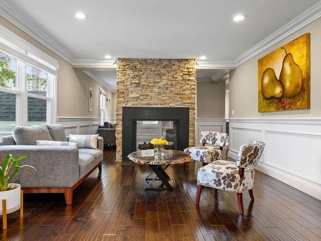 83 Altamont Ave, Melrose, MA 02176 - living room with ornamental molding, a decorative wall, a wainscoted wall, hardwood / wood-style floors, and a fireplace