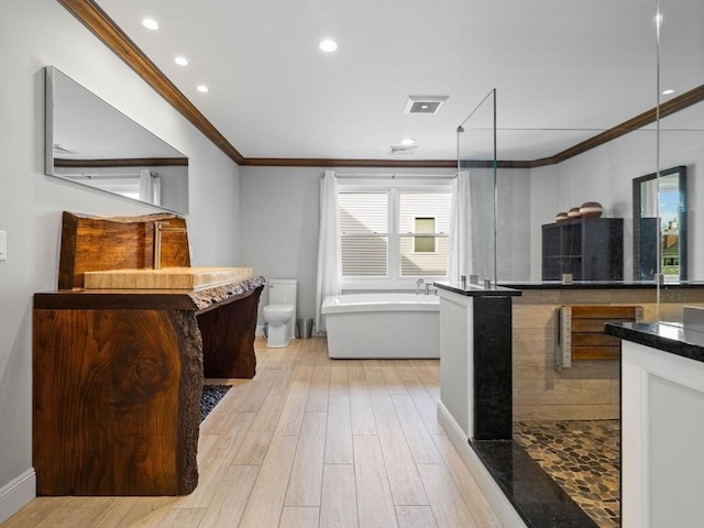 83 Altamont Ave, Melrose, MA 02176 - kitchen featuring crown molding, light wood-style flooring, dark countertops, and recessed lighting