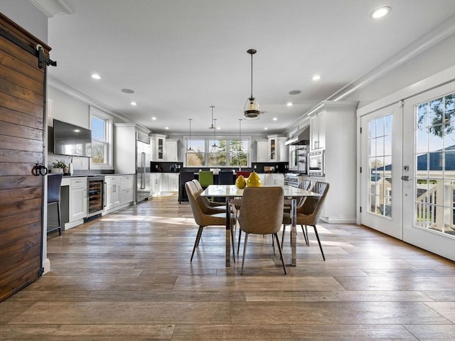 83 Altamont Ave, Melrose, MA 02176 - dining area featuring dark wood-style flooring, french doors, ornamental molding, and recessed lighting