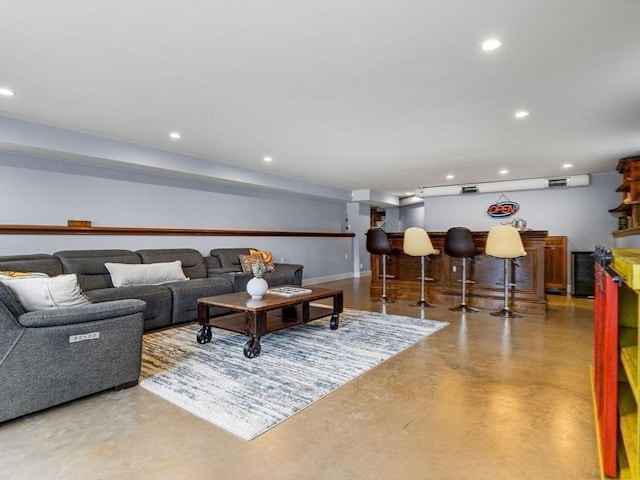 83 Altamont Ave, Melrose, MA 02176 - living area featuring finished concrete flooring, indoor bar, baseboards, and recessed lighting