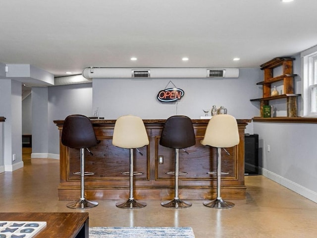 83 Altamont Ave, Melrose, MA 02176 - bar featuring a dry bar, finished concrete floors, visible vents, recessed lighting, and baseboards