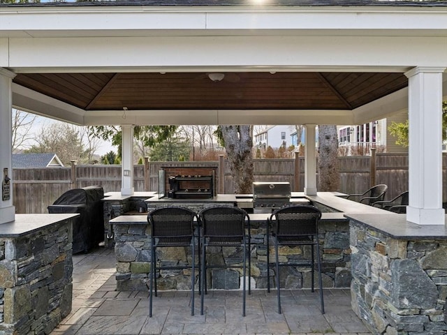 83 Altamont Ave, Melrose, MA 02176 - view of patio with area for grilling, a fenced backyard, a gazebo, and outdoor wet bar