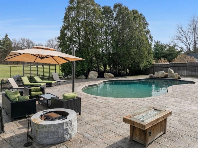 83 Altamont Ave, Melrose, MA 02176 - view of pool featuring an outdoor living space with a fire pit, a patio area, a fenced backyard, and a fenced in pool