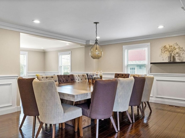 83 Altamont Ave, Melrose, MA 02176 - dining space with a wainscoted wall, dark wood-type flooring, a decorative wall, and crown molding
