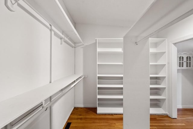 spacious closet featuring visible vents and light wood finished floors