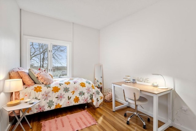 bedroom with wood finished floors