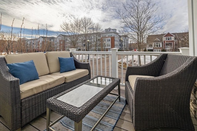 wooden terrace with a residential view and outdoor lounge area