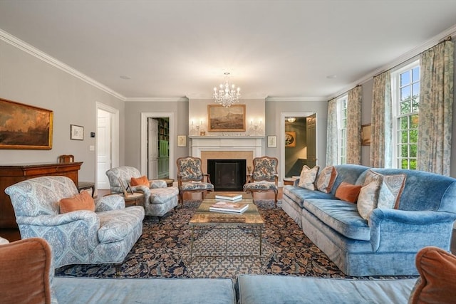 living room with a notable chandelier and crown molding