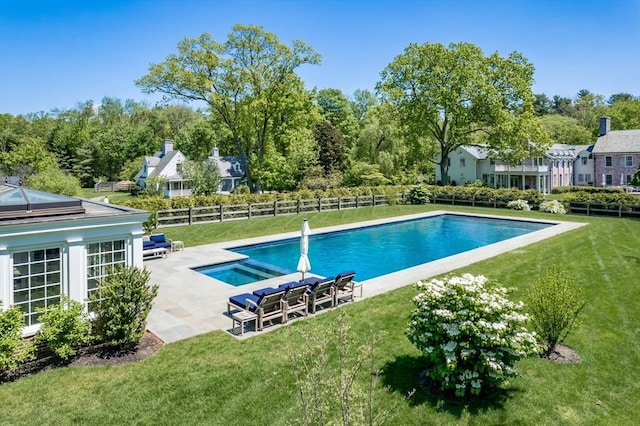 view of pool with a yard and a patio