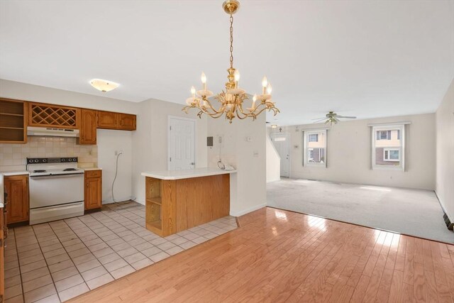kitchen with open shelves, white electric range, open floor plan, and under cabinet range hood