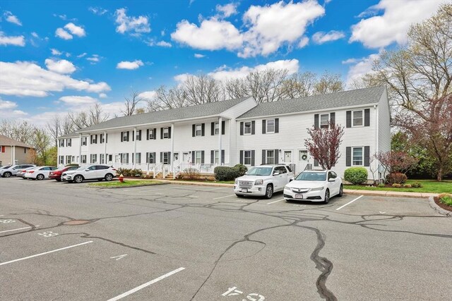 view of property with uncovered parking