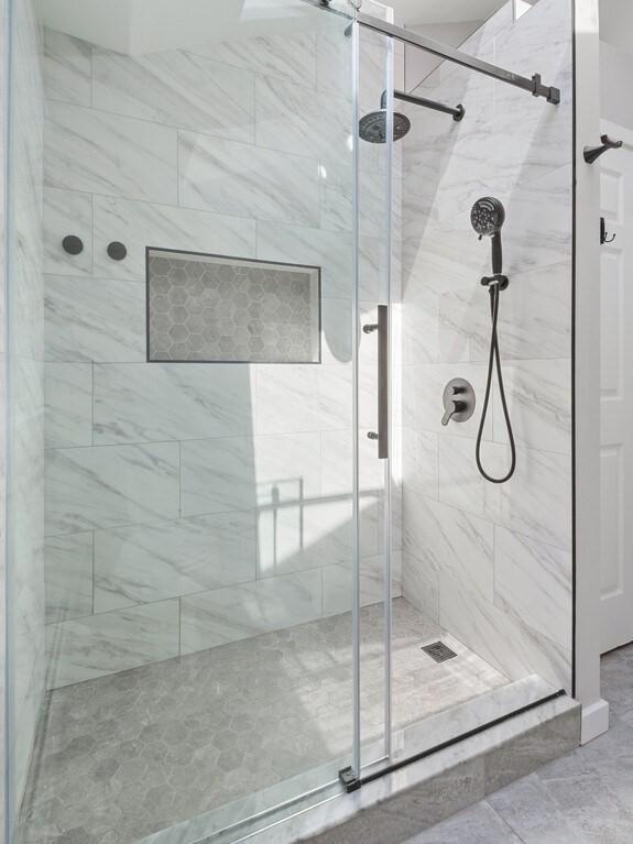 full bathroom featuring a shower stall