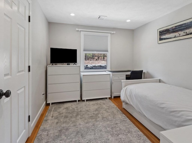 bedroom featuring visible vents, recessed lighting, and light wood finished floors