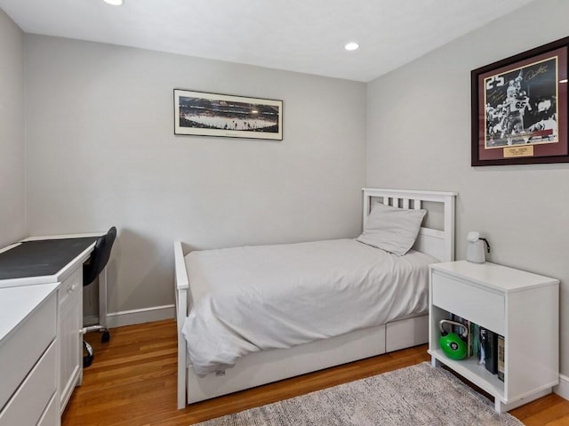 bedroom featuring recessed lighting, light wood finished floors, and baseboards