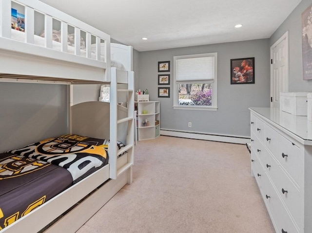 bedroom featuring recessed lighting, light carpet, and a baseboard heating unit