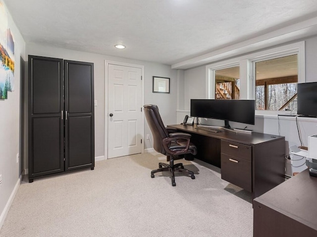 home office featuring light colored carpet, recessed lighting, and baseboards