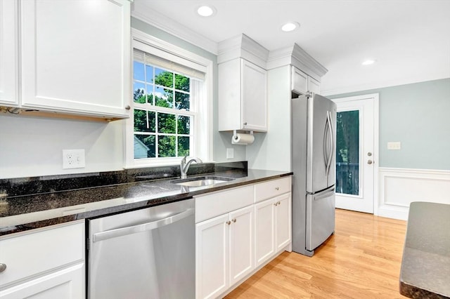 5 Allen St Unit 5, Woburn, MA 01801 - kitchen featuring stainless steel appliances, wainscoting, white cabinetry, light wood-style flooring, and dark stone countertops