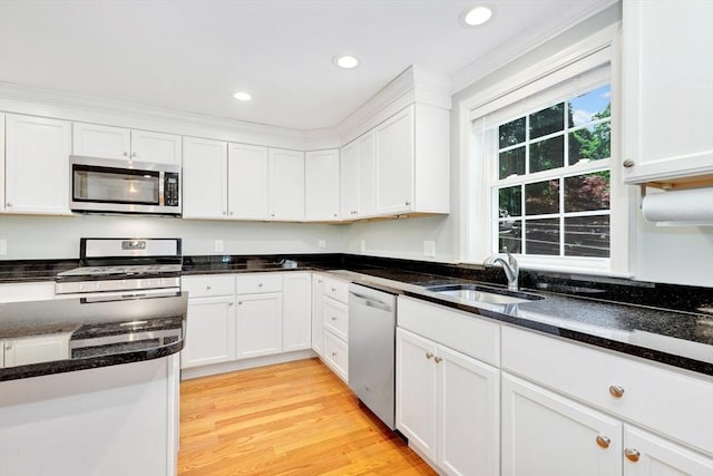 5 Allen St Unit 5, Woburn, MA 01801 - kitchen with stainless steel appliances, white cabinets, dark stone counters, recessed lighting, and light wood-type flooring