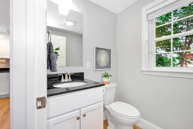 5 Allen St Unit 5, Woburn, MA 01801 - half bath with vanity, plenty of natural light, and wood finished floors