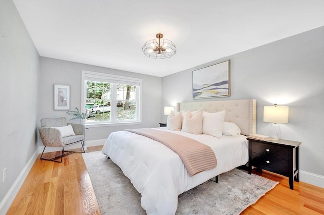 5 Allen St Unit 5, Woburn, MA 01801 - bedroom featuring light wood-style floors and a chandelier