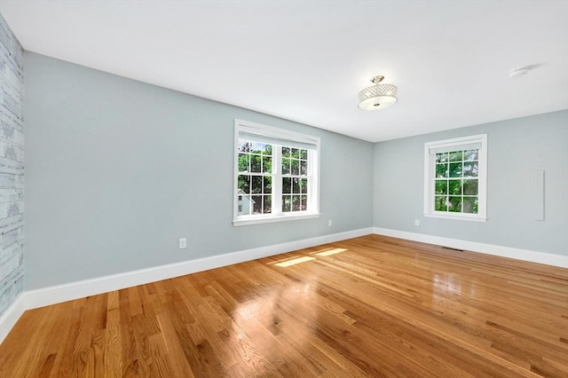 5 Allen St Unit 5, Woburn, MA 01801 - empty room featuring healthy amount of natural light, light wood-style flooring, and a smoke detector