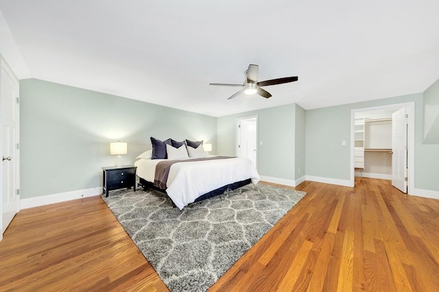 5 Allen St Unit 5, Woburn, MA 01801 - bedroom featuring wood finished floors, a ceiling fan, and a walk in closet