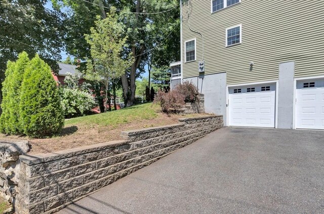 5 Allen St Unit 5, Woburn, MA 01801 - view of home's exterior with asphalt driveway and an attached garage