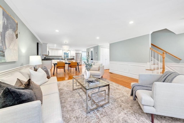 5 Allen St Unit 5, Woburn, MA 01801 - living room with crown molding, light wood-style flooring, a wainscoted wall, stairway, and recessed lighting