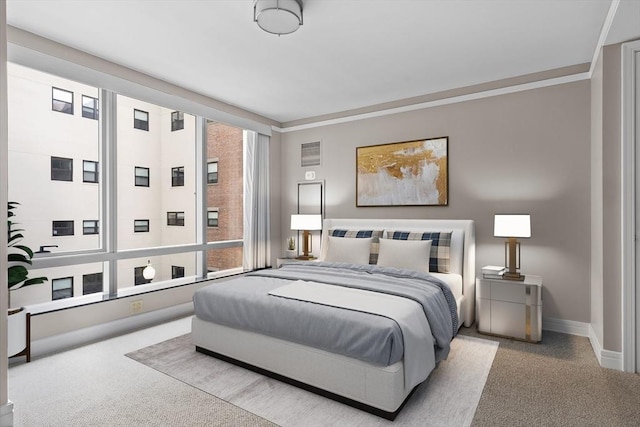 bedroom with light colored carpet and crown molding