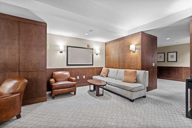 interior space featuring light colored carpet and wooden walls