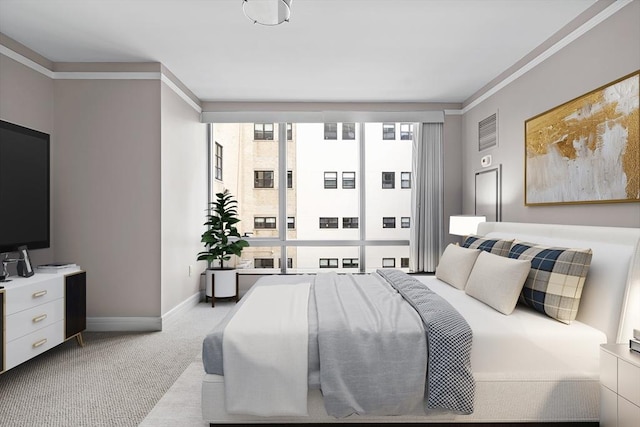 bedroom with light colored carpet and ornamental molding