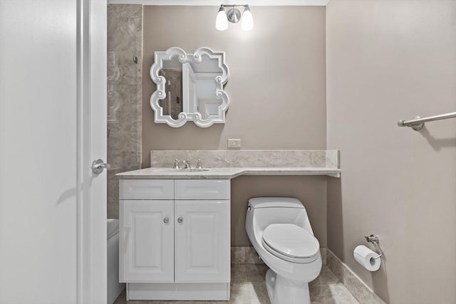 bathroom featuring tile patterned floors, vanity, and toilet