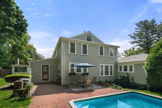 40 Washington St, Hanover, MA 02339 - back of property featuring a patio and an outdoor pool