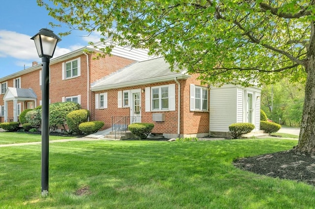 108 Emerson Gardens Rd Unit 108, Lexington, MA 02420 - view of front facade featuring brick siding and a front yard