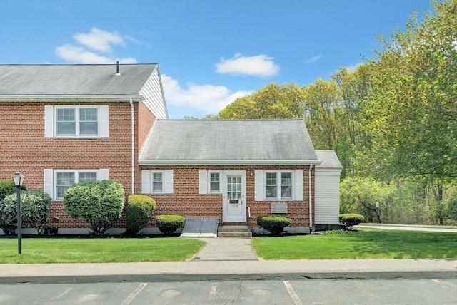 108 Emerson Gardens Rd Unit 108, Lexington, MA 02420 - view of front facade featuring a front lawn, brick siding, and entry steps