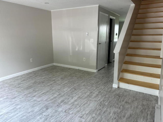 450-458 Riverside Dr Unit 2, Lawrence, MA 01841 - stairway with wood finished floors and a textured ceiling