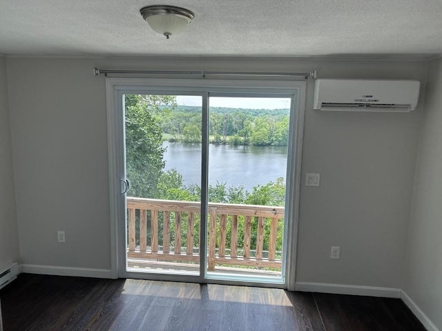 450-458 Riverside Dr Unit 2, Lawrence, MA 01841 - doorway to outside with a wall mounted AC, a water view, dark wood-style flooring, and a textured ceiling