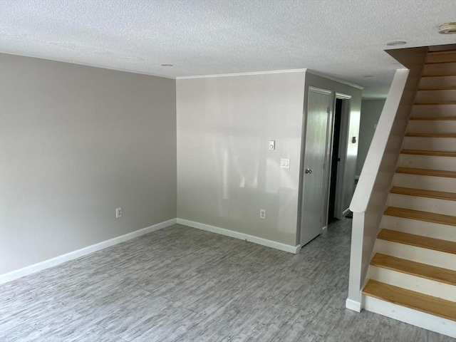 450-458 Riverside Dr Unit 2, Lawrence, MA 01841 - empty room with stairway, wood finished floors, and a textured ceiling