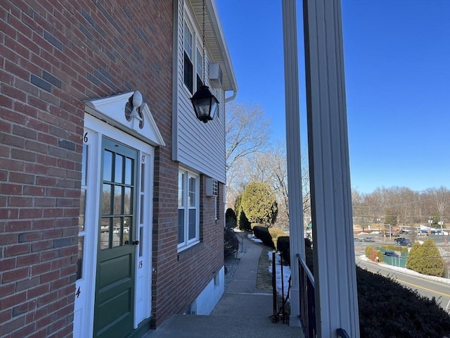 view of property exterior featuring brick siding