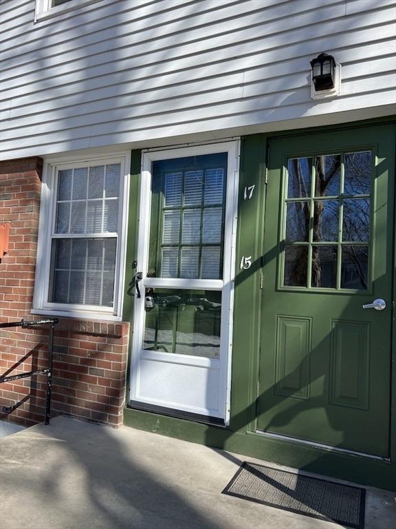 entrance to property with brick siding