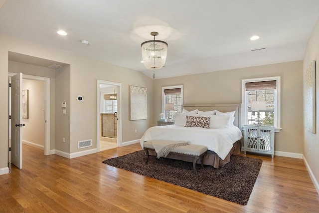 bedroom with recessed lighting, wood finished floors, visible vents, and baseboards