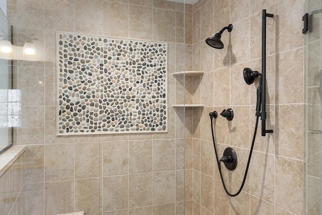 bathroom with tiled shower