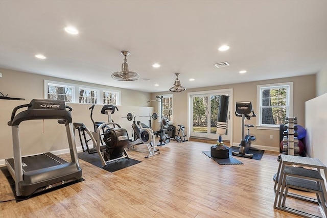 gym featuring visible vents, recessed lighting, and wood finished floors